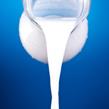 Closeup Of A Jug With Pouring Milk