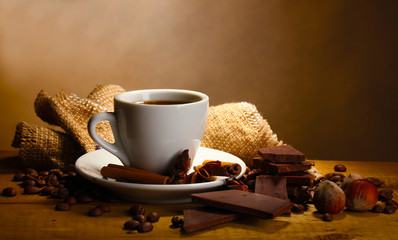 Wall Mural - coffee cup and beans, cinnamon sticks, nuts and chocolate