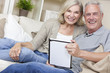 © Darren Baker - Happy Senior Man & Woman Couple Using Tablet Computer