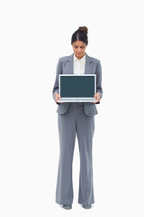 Poster - Saleswoman looking at notebook in her hands