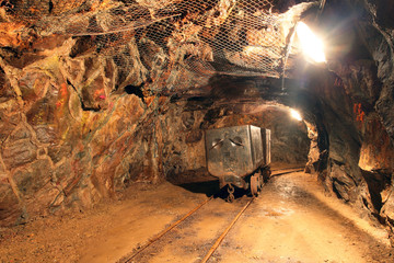 Wall Mural - Underground train in mine, carts in gold, silver and copper mine