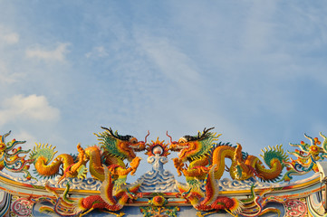 Wall Mural - Chinese style dragons on temple's roof.