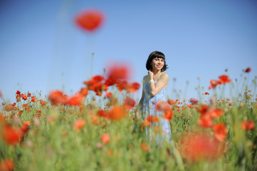 Sticker - Smiling girl among poppies