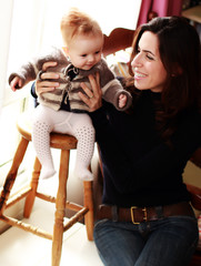 Wall Mural - mother and young daughter in home interior