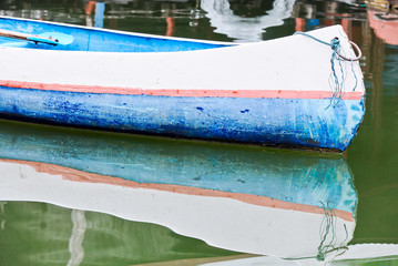 Lonely blue rowboat