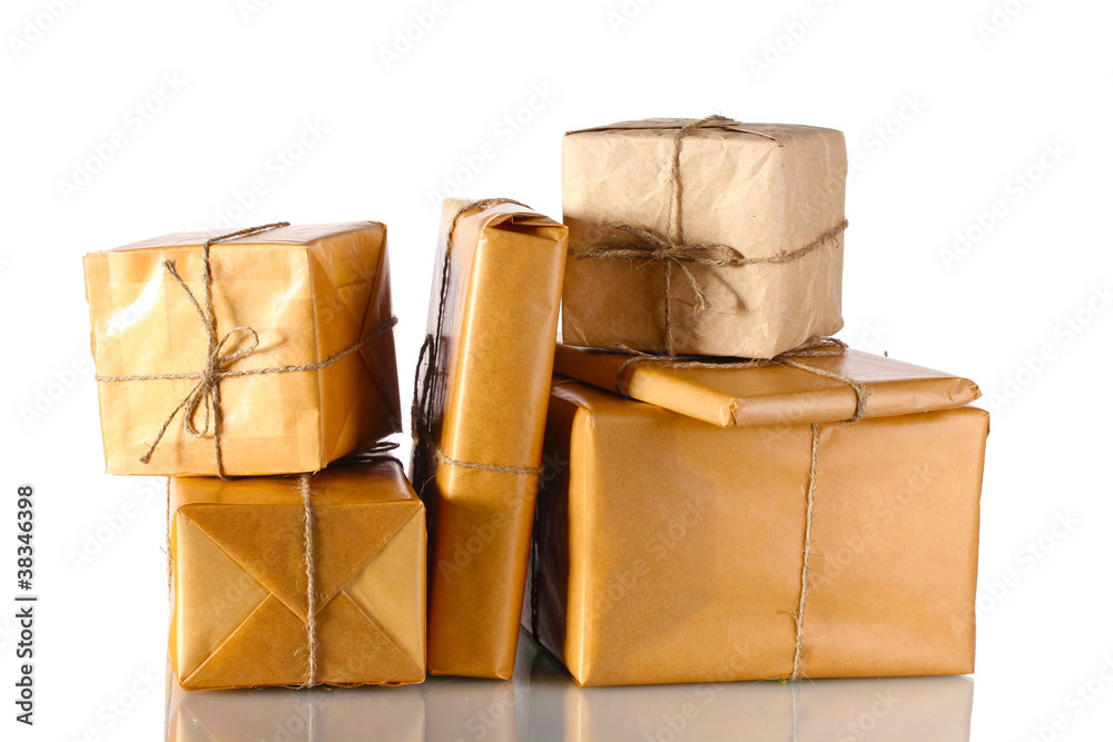 Many parcels wrapped in brown paper tied