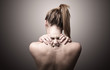 © ra2 studio - back of a woman indicating neck pain