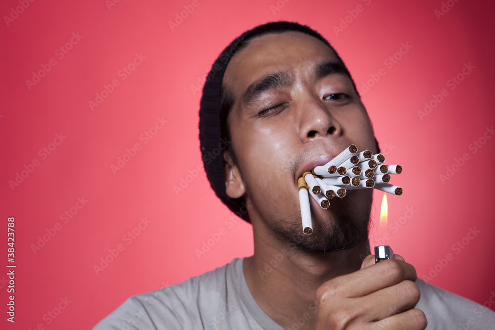 smoking many cigarettes meme Smoker with lots of cigarettes Stock Photo