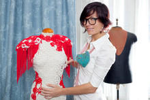 Dressmaker With Mannequin Working At Home