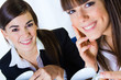 © nenetus - two business women drinking coffee in the office