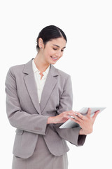 Poster - Smiling saleswoman using her tablet computer