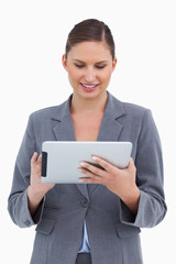 Poster - Smiling tradeswoman using her tablet computer