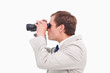 © WavebreakmediaMicro - Side view of businessman using spy glasses