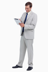 Poster - Smiling businessman using tablet computer