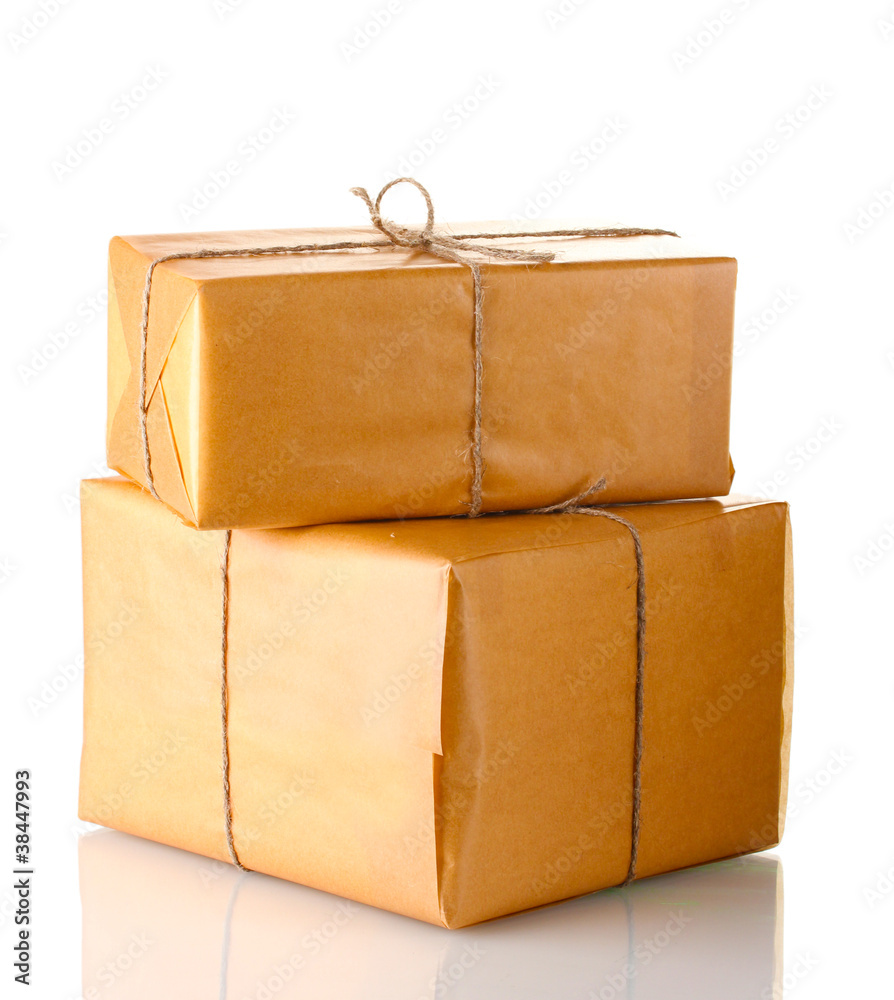 Two parcels wrapped in brown paper tied