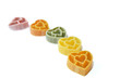 Line of heart shaped colorful pasta