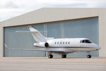 Airplane in front of hangar