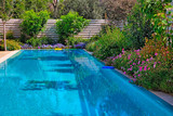 Fototapeta  - Swimming pool with flowers