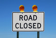 © sbgoodwin - Road closed sign against a bright blue sky