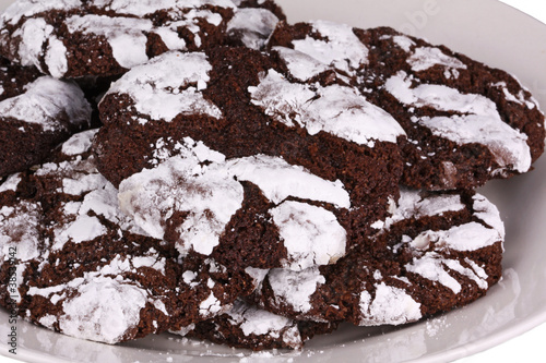 Fotografia, Obraz Mound of chocolate crinkle cookies against a white background