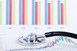 Stethoscope on a stock chart - market analysis