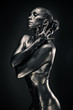 Nude woman like statue in liquid metal 