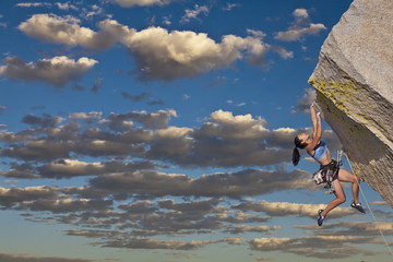 Wall Mural - Rock climber dangling.