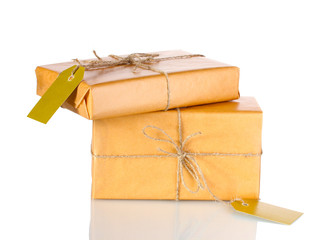 Two parcels wrapped in brown paper tied with twine