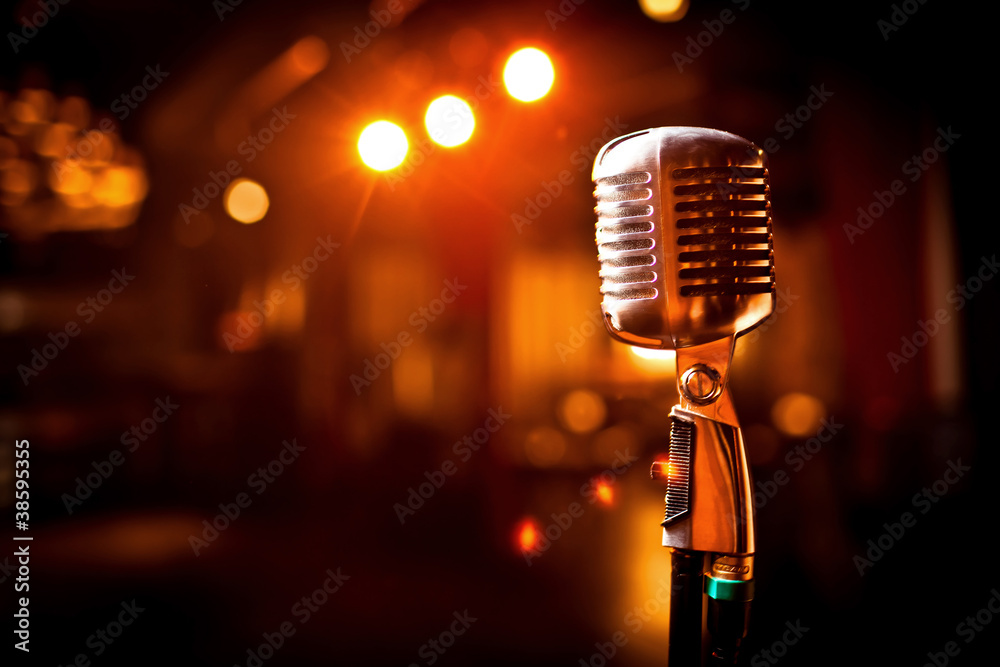 Retro microphone on stage - obrazy, fototapety, plakaty 