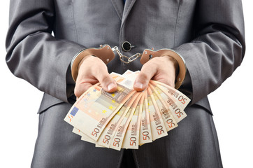 Handcuffed man with euro banknotes