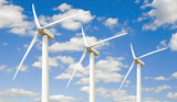 Three wind turbines -  against the sky
