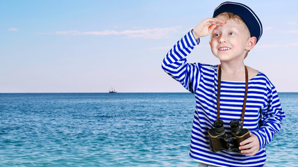 Fototapete - Little ship boy with binocular in hands