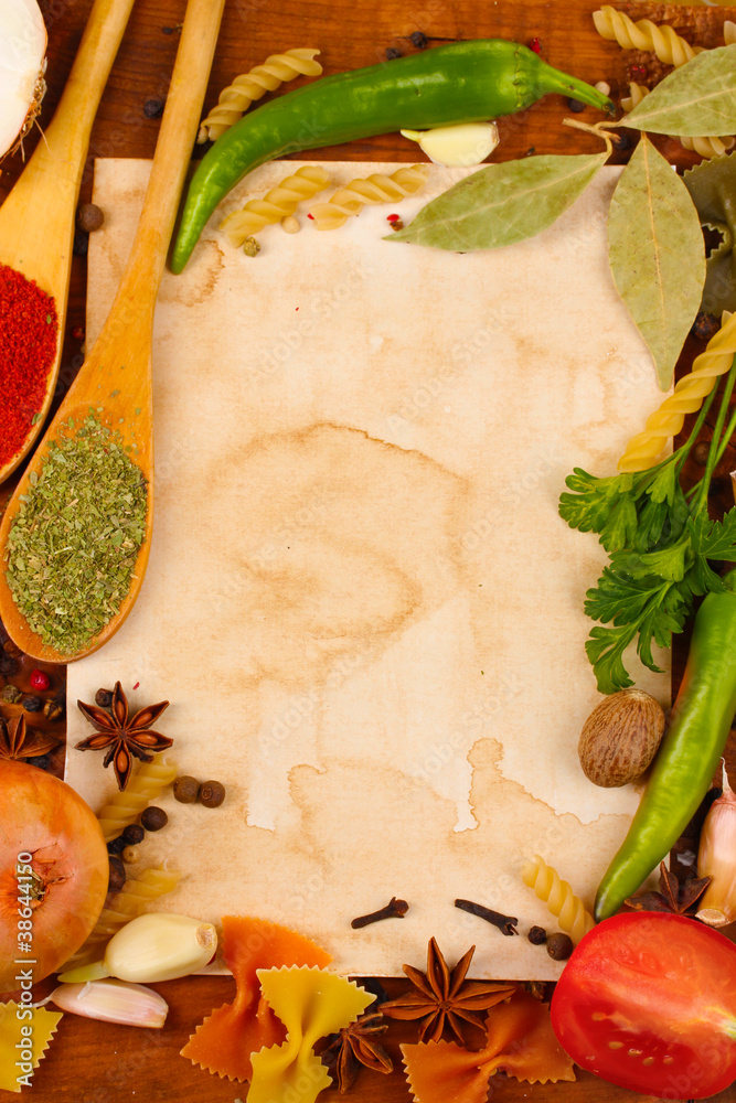 old paper for recipes and spices on wooden table