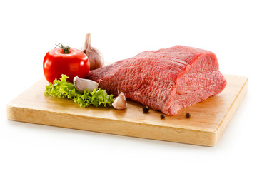 Raw beef on cutting board on white background