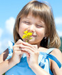 Happy young girl with a flower in his hand
