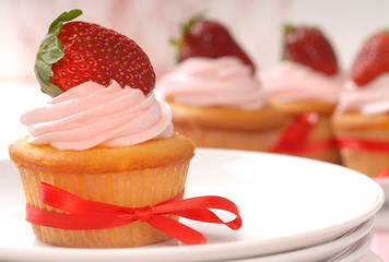 Wall Mural - Delicious Vanilla cupcake with strawberry frosting