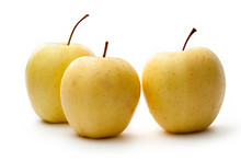 Three Yellow Apples On White