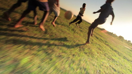 children playing soccer in kenya, africa