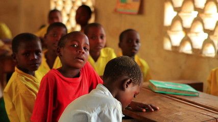 school children in a classroom in africa.