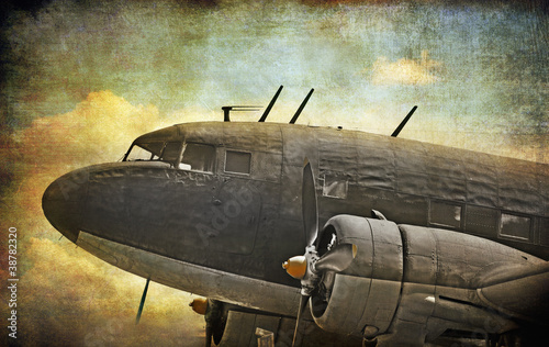 Obraz w ramie Old military aircraft, grunge background