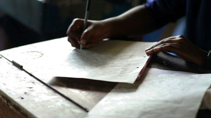 Wall Mural - Student studying and taking a test in a school in Africa, African
