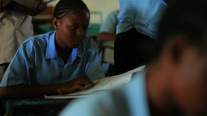 Wall Mural - Students taking an exam in class in Kenya.