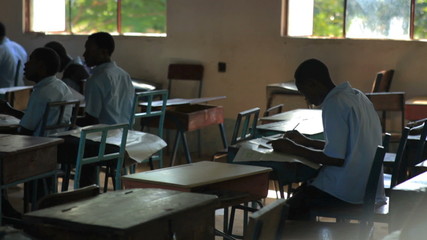 Wall Mural - Africa Students taking a test in a class in Kenya.