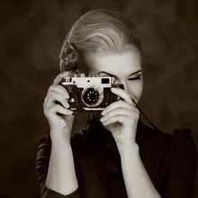 Woman In Classic Dress With Retro Camera.