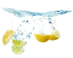 Wall Mural - slices of lemon and lime in the water