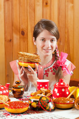 Wall Mural - Girl in traditional  clothes with pancake