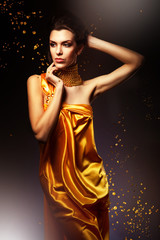 Wall Mural - woman in long yellow dress and jewelry