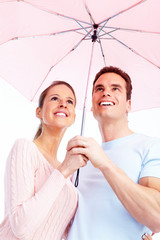 Wall Mural - Happy couple in love under umbrella.