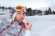 Portrait of a skier applying lip balm