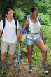 © auremar - An interracial couple mountain hiking.